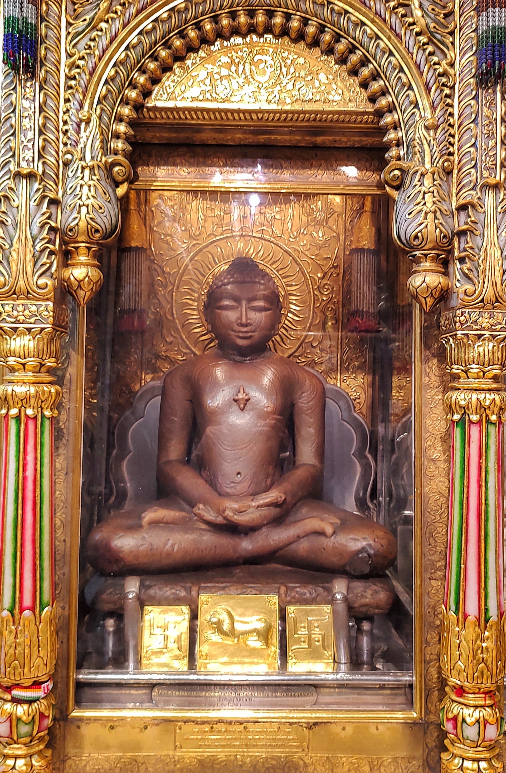 The honey-coloured stone idol of Bhagwan Mahaveer in a golden shrine at Shri Mahavirji, Rajasthan