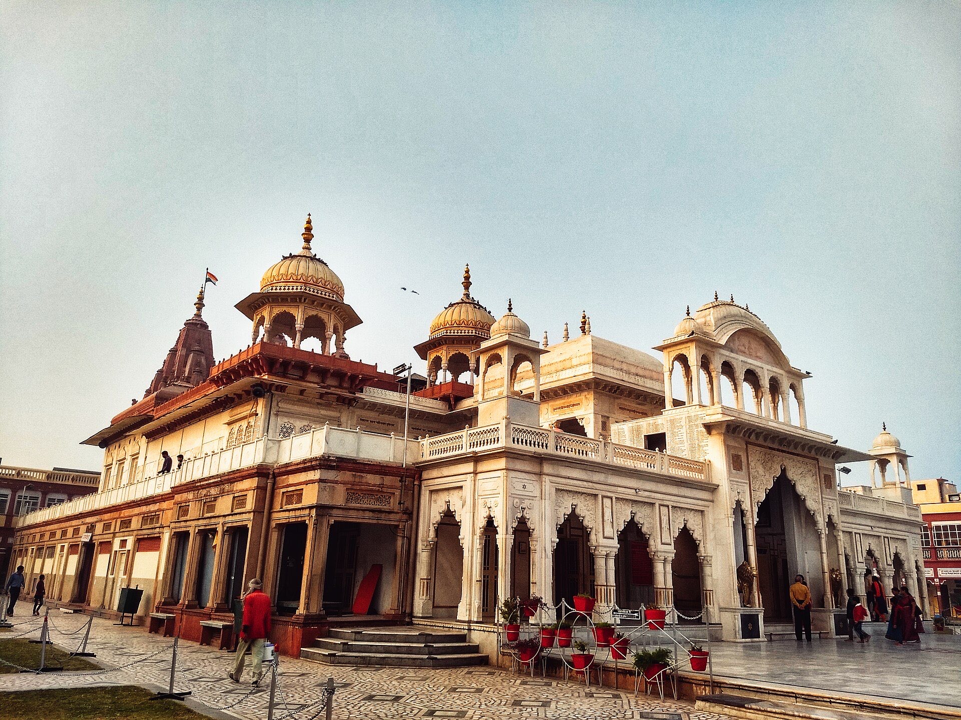The white shikhara of the Shri Mahavirji temple in Rajasthan against a blue sky